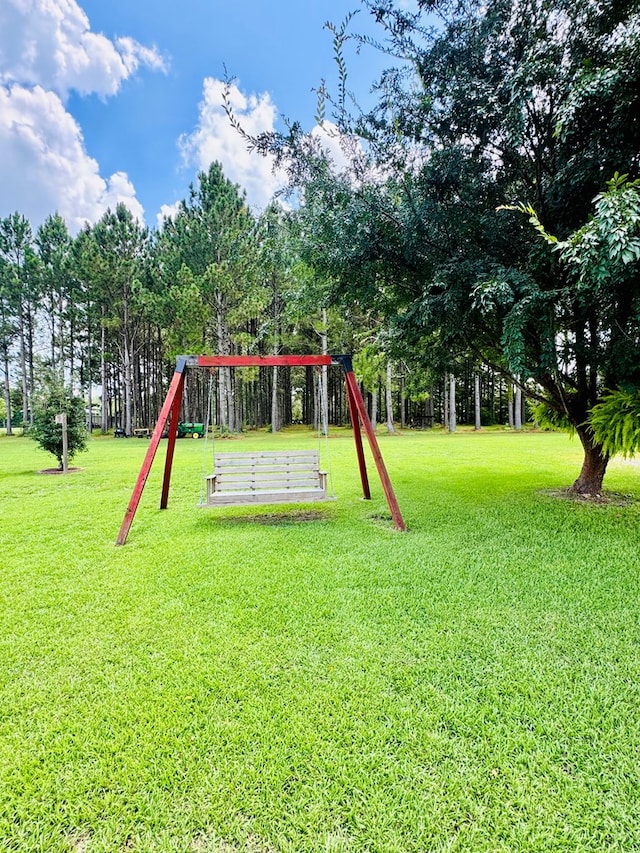 view of playground featuring a yard