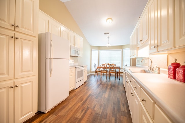 186 Turtle Pond Rd, Bainbridge, GA 39817 - kitchen featuring white appliances, vaulted ceiling, dark wood-style flooring, light countertops, and pendant lighting