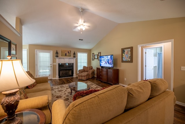 186 Turtle Pond Rd, Bainbridge, GA 39817 - living area featuring lofted ceiling, dark wood-style floors, and a tiled fireplace