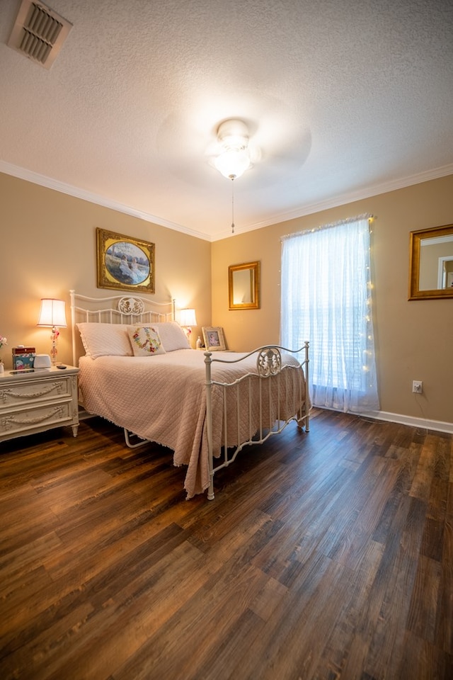 186 Turtle Pond Rd, Bainbridge, GA 39817 - bedroom featuring dark wood-style floors, ornamental molding, and a textured ceiling