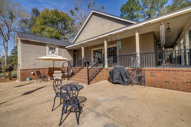 exterior space featuring crawl space, a patio area, and stucco siding