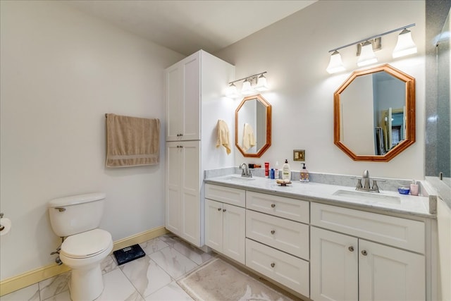 full bath with marble finish floor, a sink, and toilet