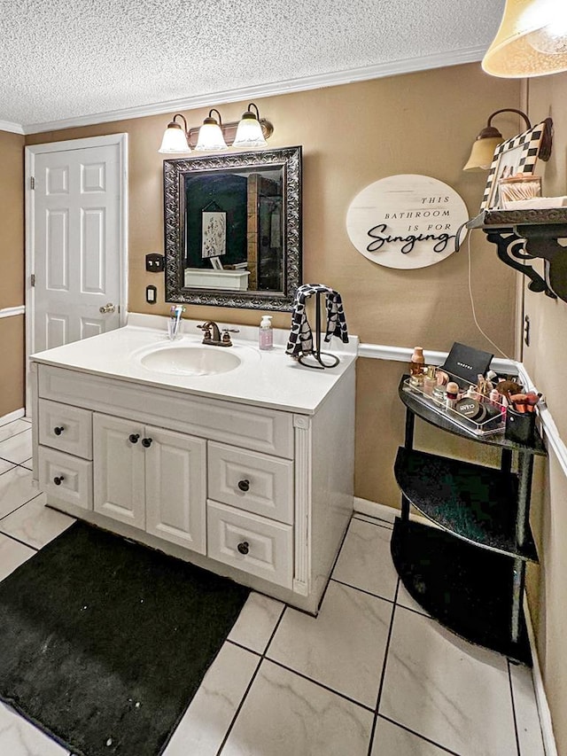102 Bremond St, Colquitt, GA 39837 - bathroom featuring a textured ceiling, vanity, ornamental molding, and tile patterned floors