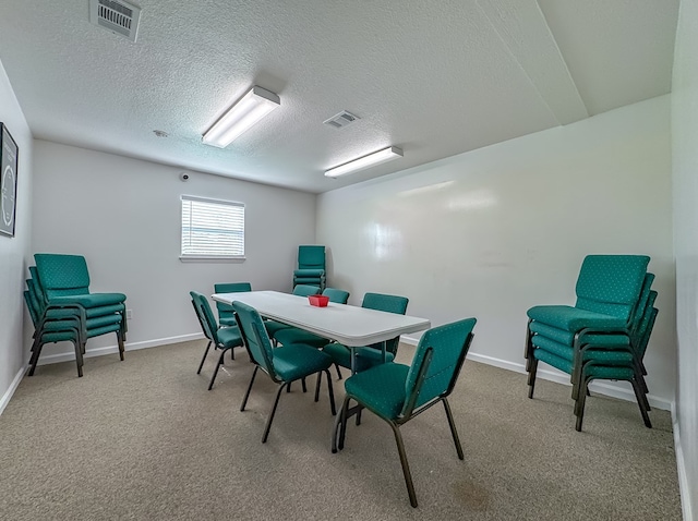 1101 Faceville Hwy, Bainbridge, GA 39819 - carpeted dining space with baseboards and a textured ceiling