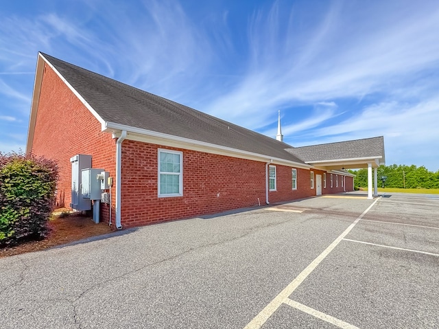 1101 Faceville Hwy, Bainbridge, GA 39819 - view of side of home with brick siding, uncovered parking, and a shingled roof