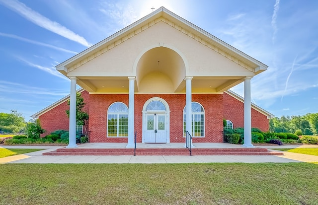 1101 Faceville Hwy, Bainbridge, GA 39819 - back of property with a lawn, a porch, and brick siding