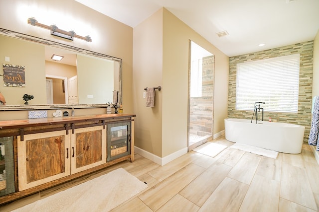 bathroom featuring a bathtub, wood-type flooring, and vanity