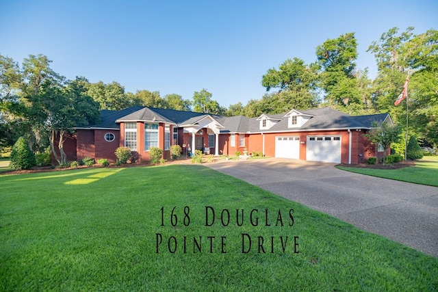 single story home featuring a garage and a front lawn