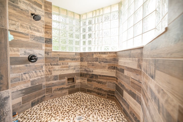 bathroom with a tile shower