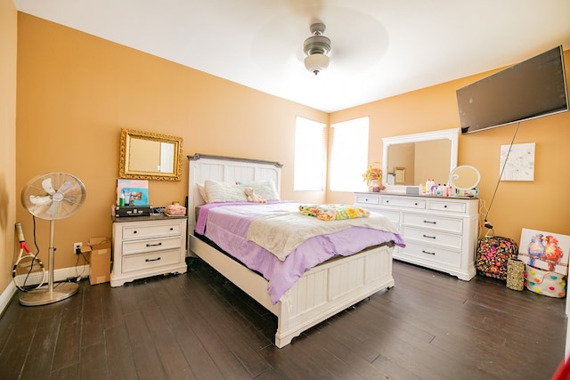 bedroom with ceiling fan and dark hardwood / wood-style floors