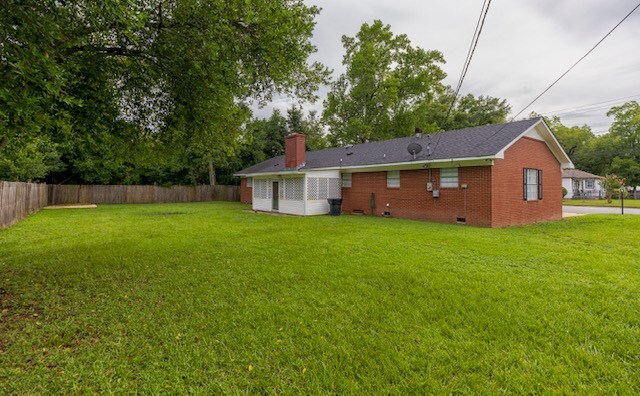 401 Simms St, Bainbridge, GA 39819 - rear view of property with crawl space, brick siding, and a chimney