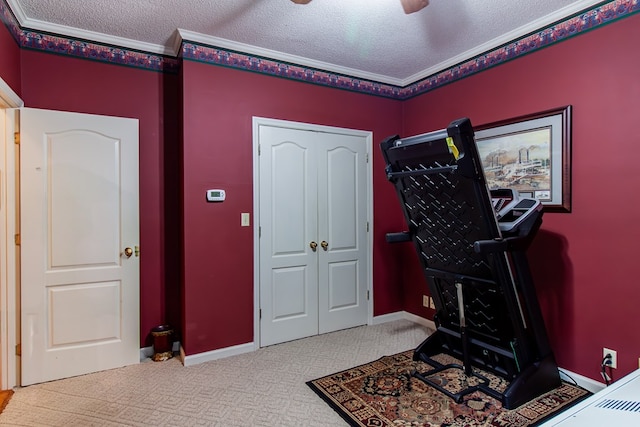 2024 Ashton Way, Bainbridge, GA 39819 - workout area with a textured ceiling, ornamental molding, carpet, a ceiling fan, and baseboards