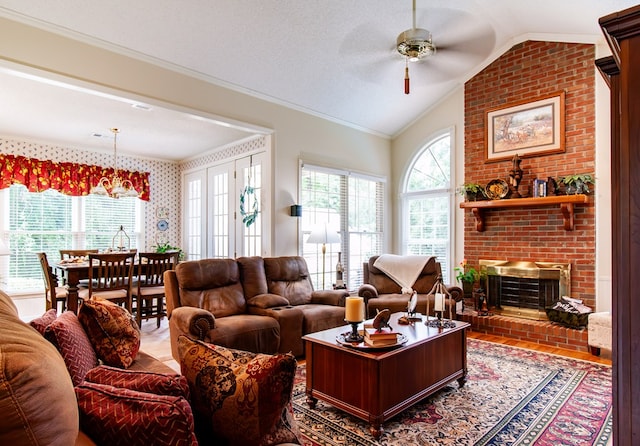 2024 Ashton Way, Bainbridge, GA 39819 - living area with a ceiling fan, lofted ceiling, healthy amount of natural light, ornamental molding, and a brick fireplace