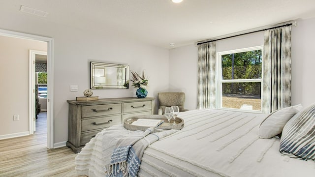 bedroom with light wood-type flooring