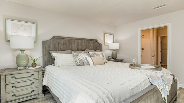 bedroom with light wood-type flooring