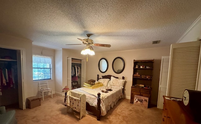 bedroom featuring ornamental molding, light carpet, and visible vents