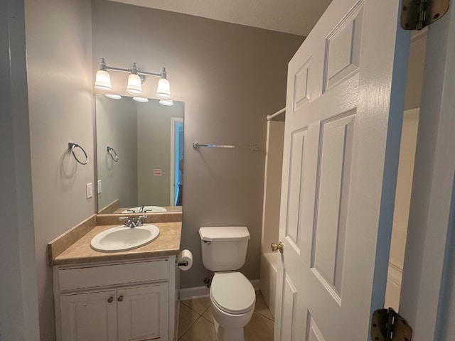 bathroom with vanity, tile patterned floors, and toilet