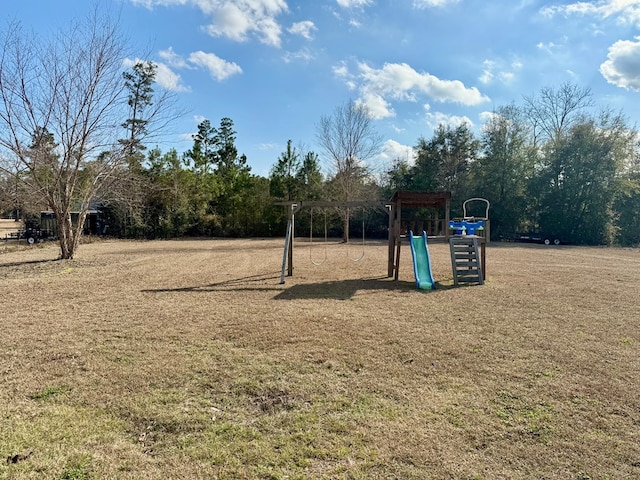 view of playground featuring a lawn