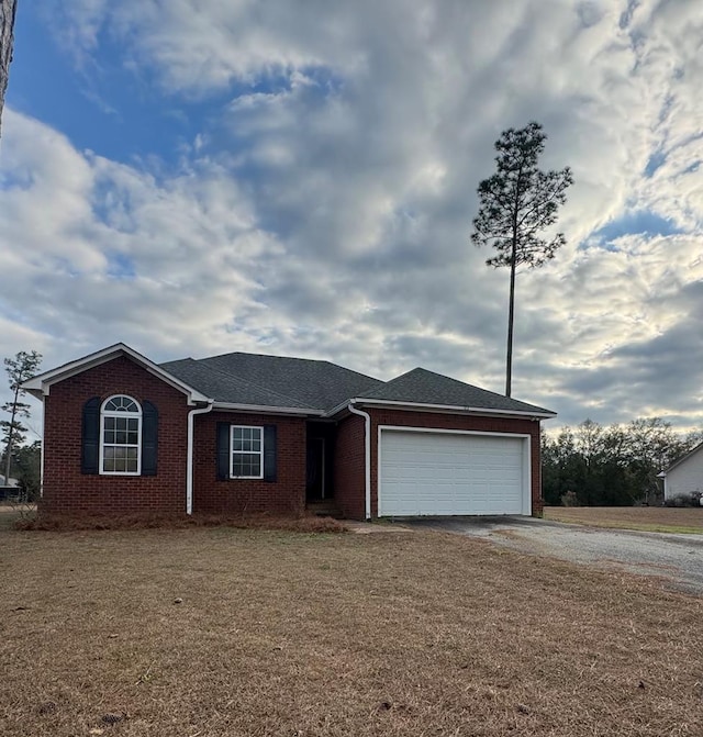 single story home with a garage