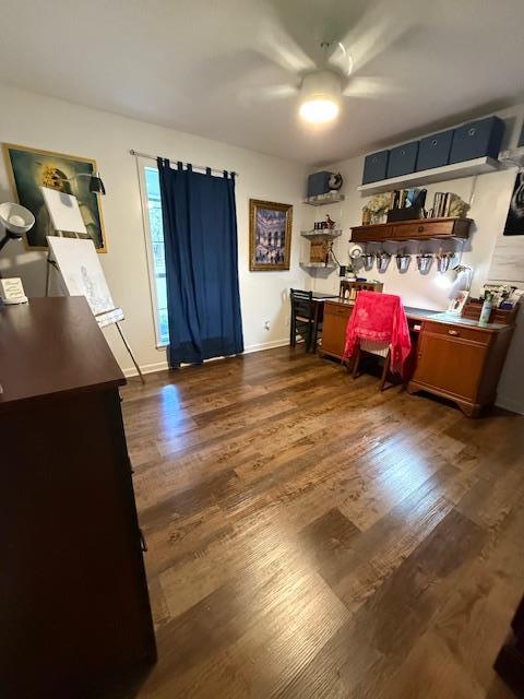 interior space featuring dark hardwood / wood-style flooring and ceiling fan