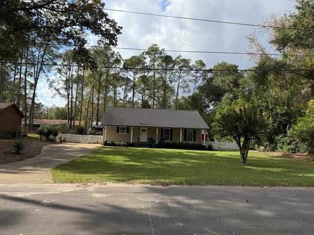 ranch-style house with a front lawn