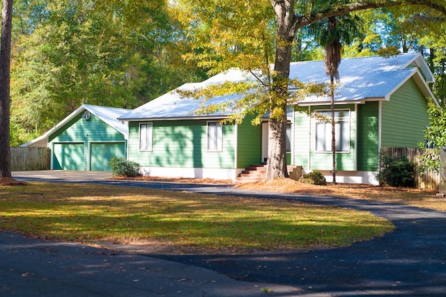 view of front facade with a front lawn and a garage