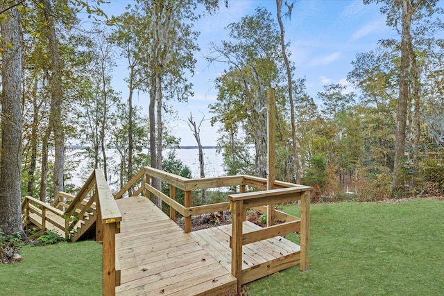 view of property's community featuring a deck and a yard