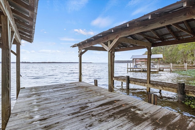 dock area featuring a water view