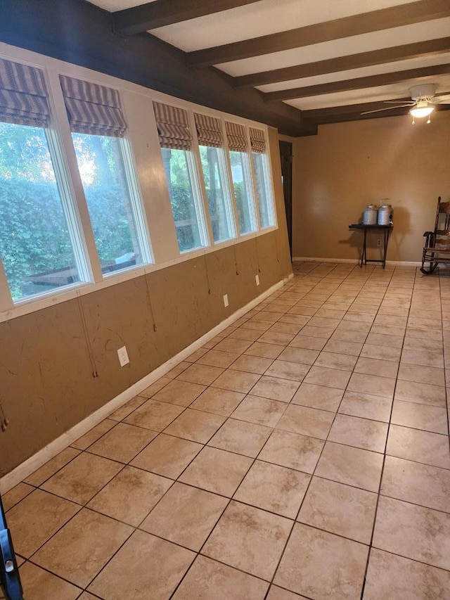 358/356 Hull St, Colquitt, GA 39837 - spare room with healthy amount of natural light, beamed ceiling, and light tile patterned floors