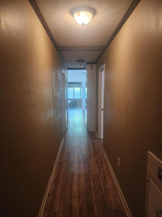 358/356 Hull St, Colquitt, GA 39837 - hall with dark wood-style floors, a textured ceiling, and ornamental molding