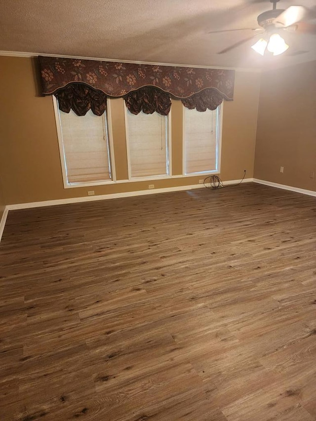 358/356 Hull St, Colquitt, GA 39837 - unfurnished room with wood finished floors, a ceiling fan, and a textured ceiling