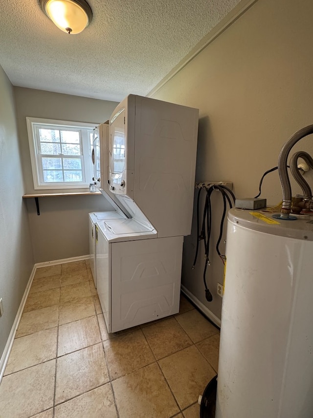 laundry area with gas water heater and a textured ceiling