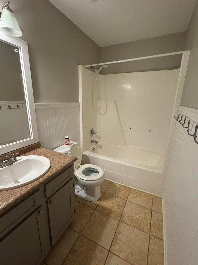 full bathroom with toilet, vanity, tile patterned floors, and bathing tub / shower combination