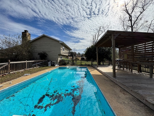 view of swimming pool featuring a deck