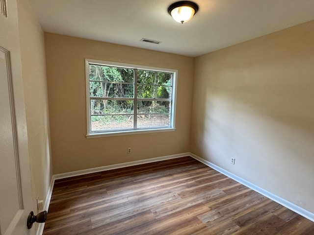 empty room featuring dark hardwood / wood-style floors