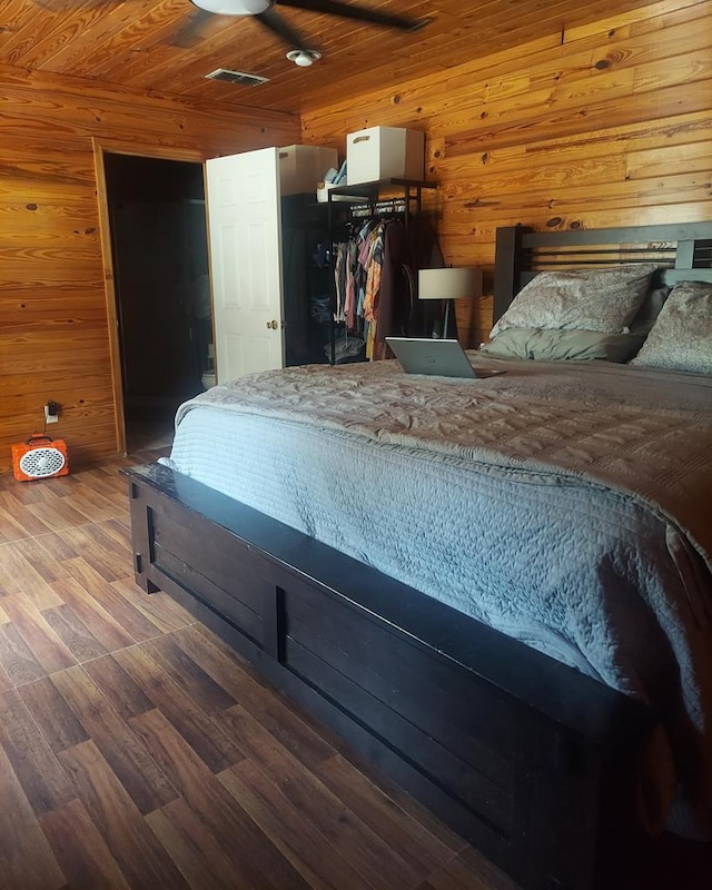 910 S Broad St, Cairo, GA 39828 - bedroom featuring wooden walls, wood finished floors, and wooden ceiling