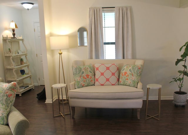 sitting room featuring dark wood-style floors and baseboards