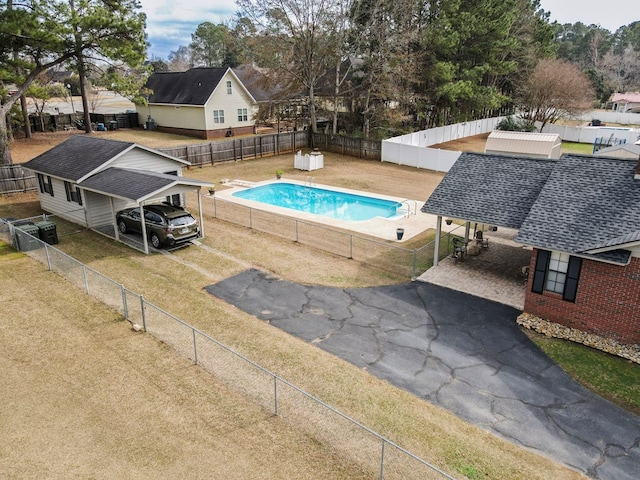 view of pool featuring a fenced in pool, a fenced backyard, and a yard