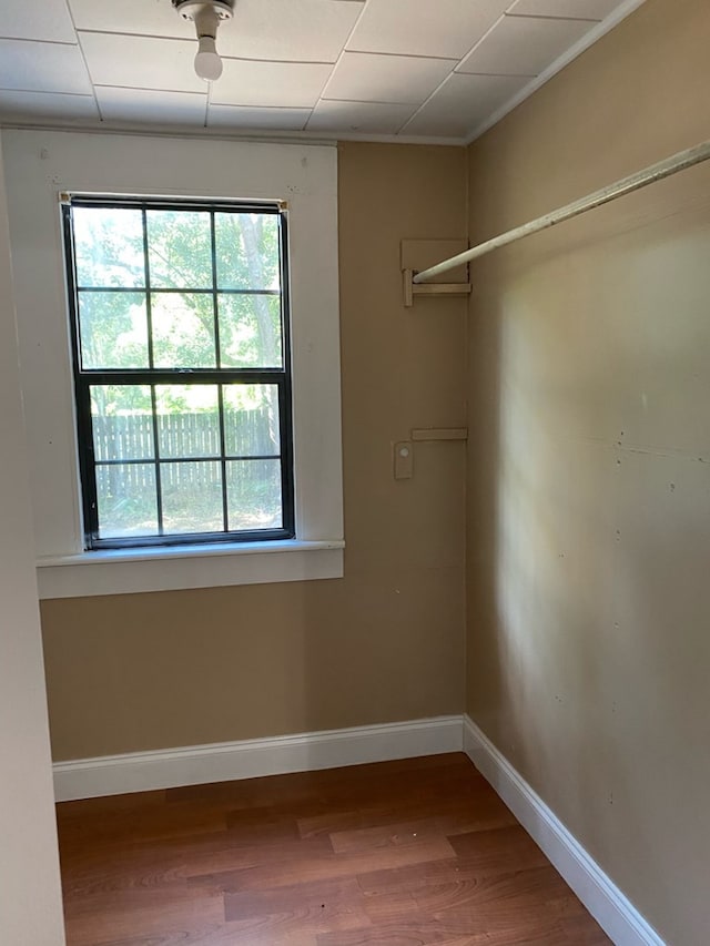 709 E College St, Bainbridge, GA 39817 - spare room featuring plenty of natural light, wood finished floors, baseboards, and crown molding