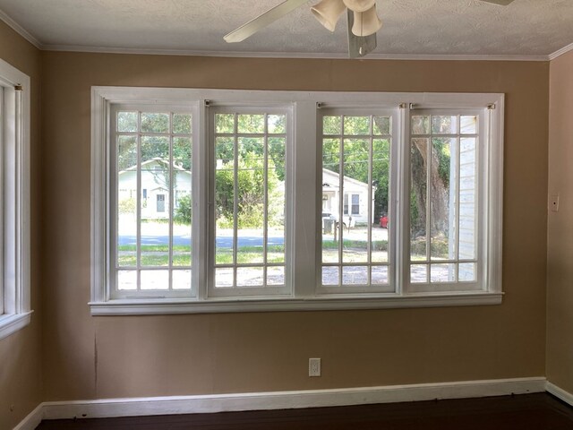 709 E College St, Bainbridge, GA 39817 - unfurnished room with baseboards, a ceiling fan, and crown molding