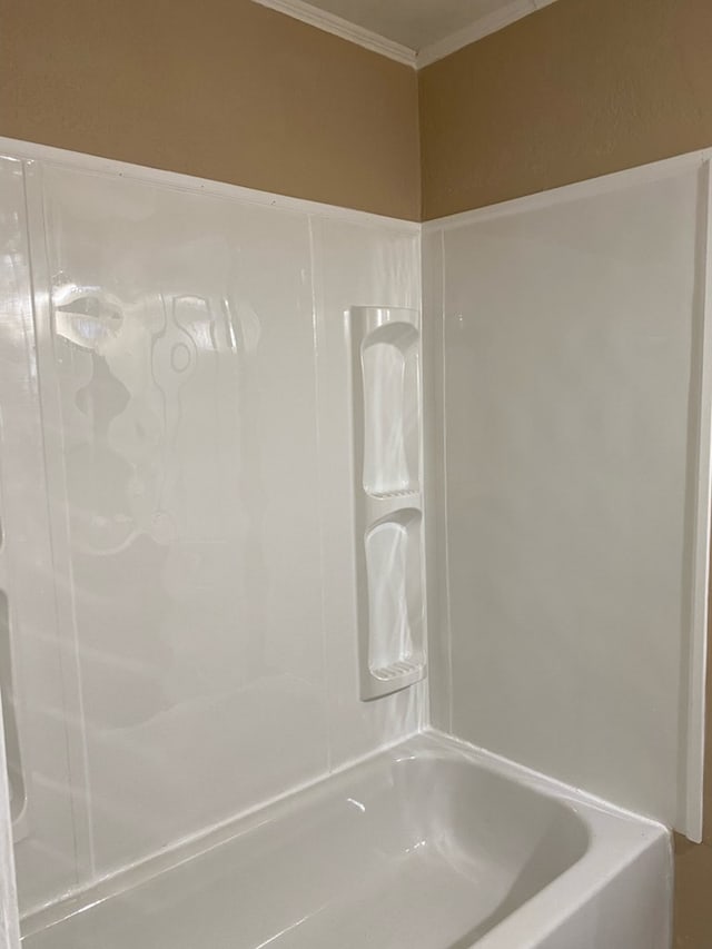709 E College St, Bainbridge, GA 39817 - bathroom with ornamental molding and tub / shower combination