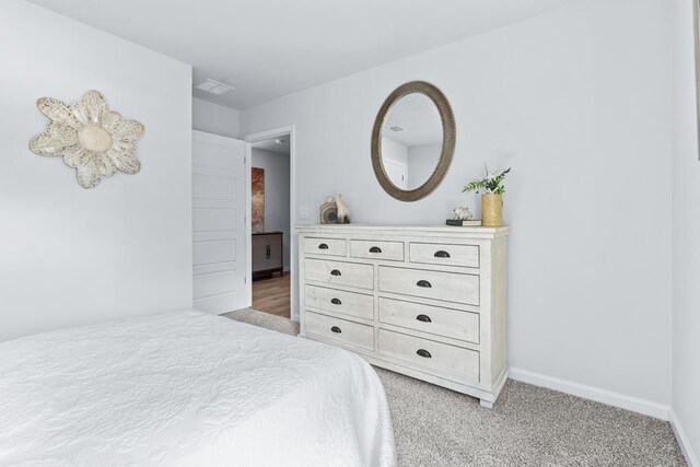 177 Wynn Ct, Bainbridge, GA 39819 - bedroom with visible vents, baseboards, and light colored carpet