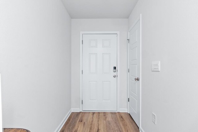 177 Wynn Ct, Bainbridge, GA 39819 - doorway with baseboards and wood finished floors
