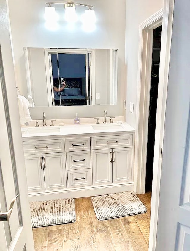 bathroom featuring hardwood / wood-style floors and vanity