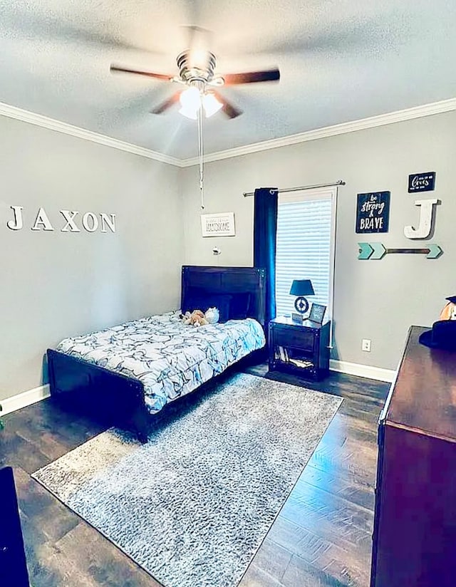 bedroom with a textured ceiling, dark hardwood / wood-style flooring, ceiling fan, and crown molding