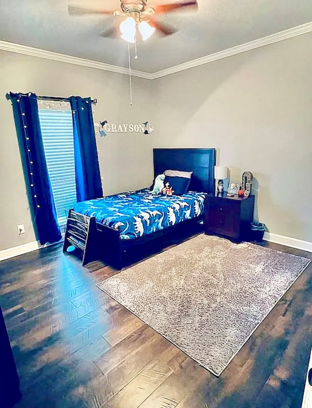 bedroom with hardwood / wood-style floors, ceiling fan, and crown molding