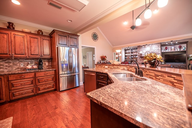 8030 Northwood Dr, Donalsonville, GA 39845 - kitchen with dark hardwood / wood-style flooring, stainless steel appliances, sink, decorative light fixtures, and lofted ceiling