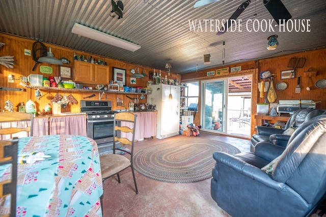 8030 Northwood Dr, Donalsonville, GA 39845 - carpeted living room featuring ceiling fan and wooden walls