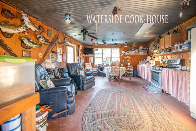 8030 Northwood Dr, Donalsonville, GA 39845 - living room featuring concrete floors, ceiling fan, and wood walls