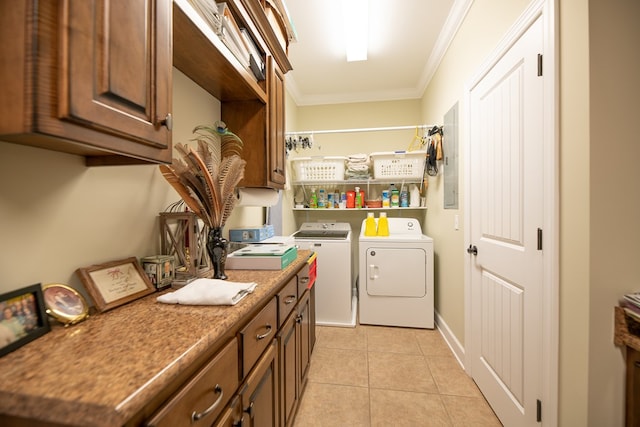 8030 Northwood Dr, Donalsonville, GA 39845 - laundry room with washer and clothes dryer, light tile patterned floors, cabinets, and ornamental molding